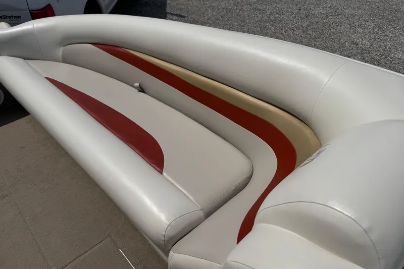 Slide: The Image of 2004 Princecraft Vacanza 250 I/O boat seating with red and beige accents. - 8