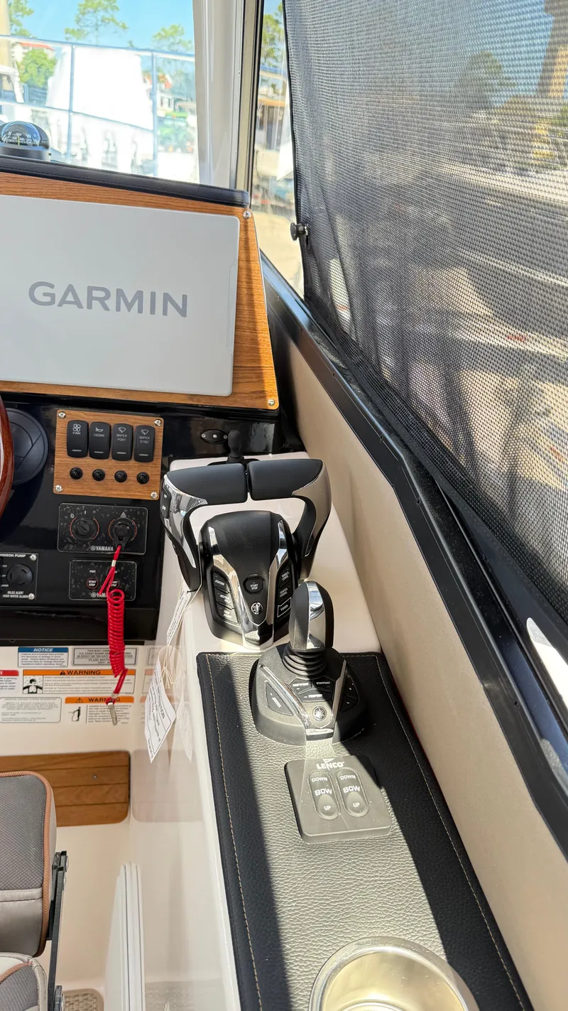 Slide: The Image of 2026 Cutwater C-288 Coupe helm with Garmin navigation and control panel. - 19