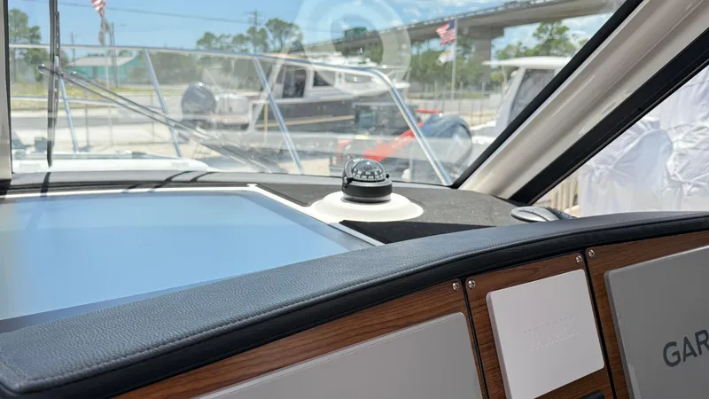 Slide: The Image of Interior view of 2026 Cutwater C-288 Coupe boat dashboard with navigation equipment. - 22