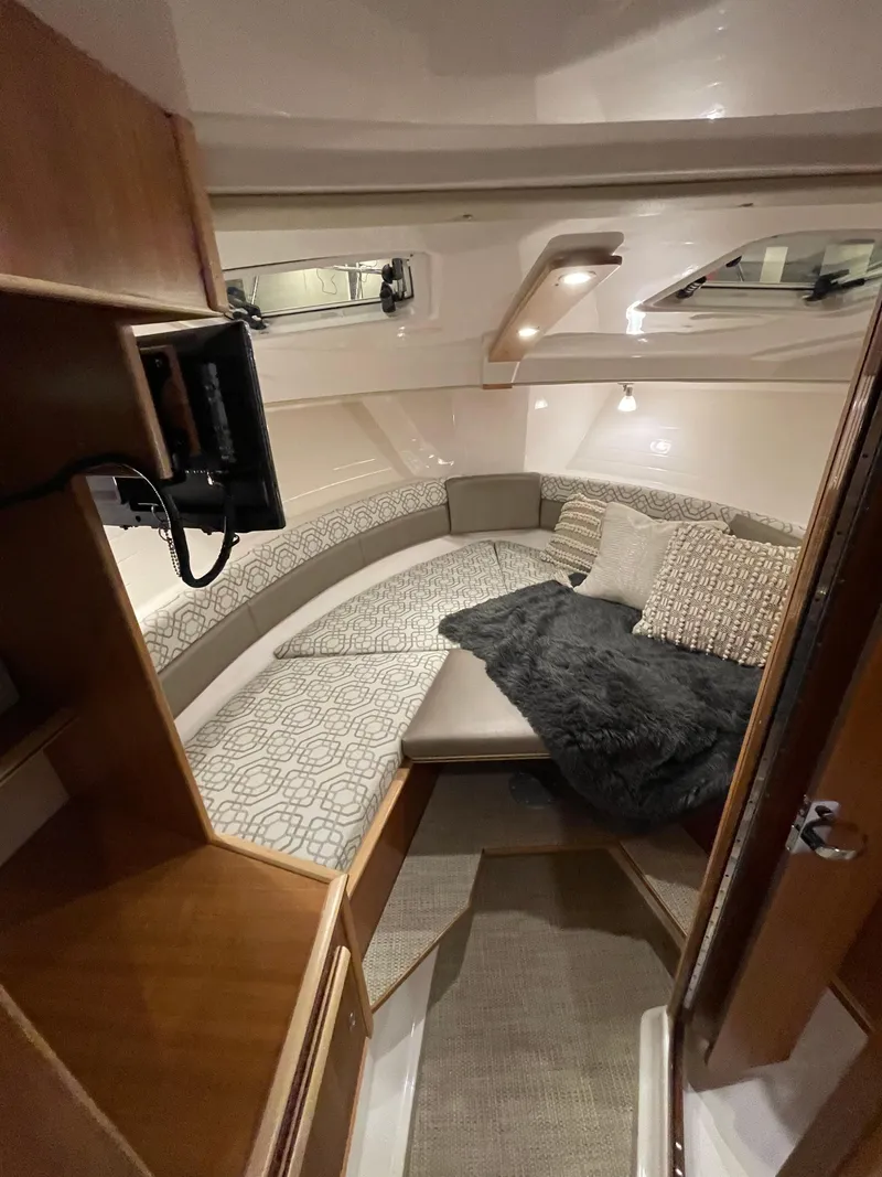 Slide: The Image of 2026 Cutwater C-288 Coupe interior cabin with cozy seating and modern design. - 32