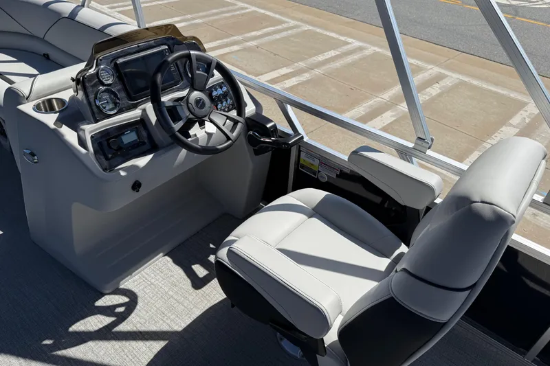 Slide: The Image of 2026 Avalon Venture 85 Versatile rear Bench boat interior with steering console and captain's chair. - 16