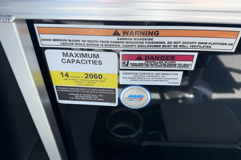 Slide: The Image of Warning and capacity labels on 2026 Avalon Venture 85 Versatile rear Bench boat. - 21