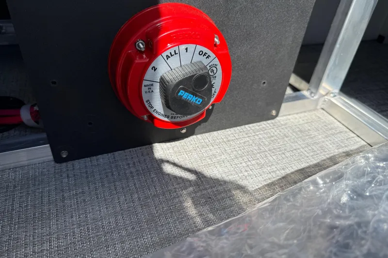 Slide: The Image of Red Perko battery switch on 2026 Avalon Venture 85 Versatile rear bench boat. - 38