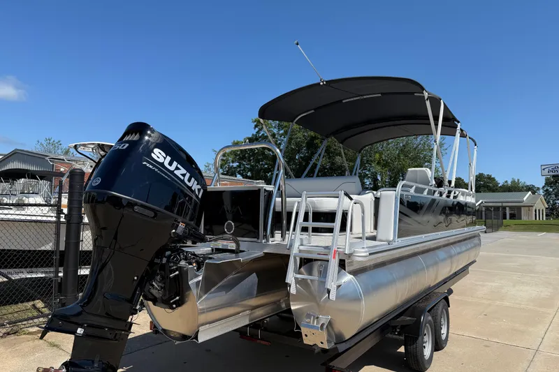 Slide: The Image of 2026 Avalon Venture 85 Versatile Rear Bench pontoon boat with Suzuki engine on trailer. - 4