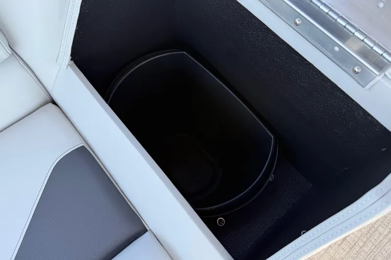 Slide: The Image of 2026 Avalon Venture 85 Versatile rear bench storage compartment with black interior. - 41