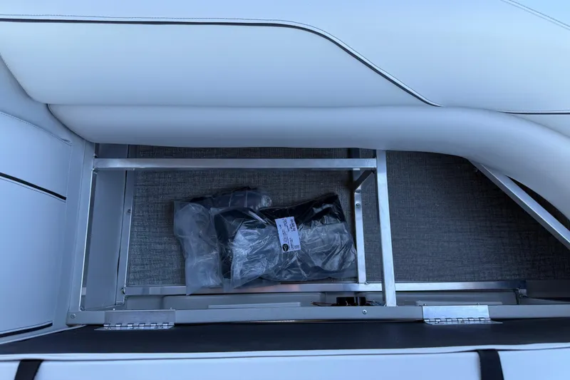 Slide: The Image of 2026 Avalon Venture 85 Versatile rear bench storage compartment with packaged items. - 42