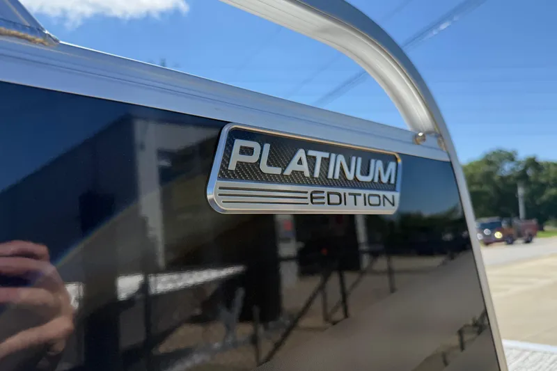 Slide: The Image of 2026 Avalon Venture 85 Versatile rear Bench, Platinum Edition badge in sunlight. - 45