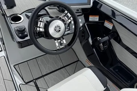 Slide: The Image of 2023 Yamaha Boats 222XD steering console with modern controls and sleek design. - 13