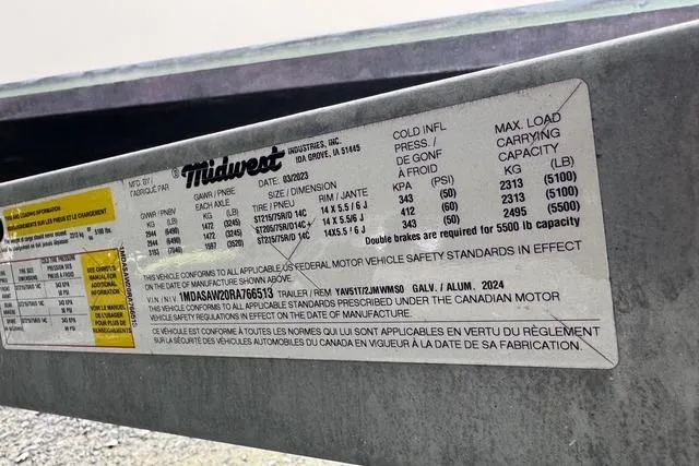 Slide: The Image of Label on a 2023 Yamaha Boats 222XD trailer, detailing tire and load specifications. - 17