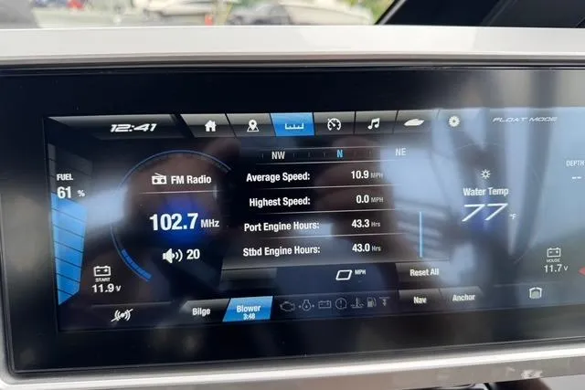Slide: The Image of Dashboard of 2023 Yamaha Boats 222XD showing speed, engine hours, and FM radio at 102.7 MHz. - 5