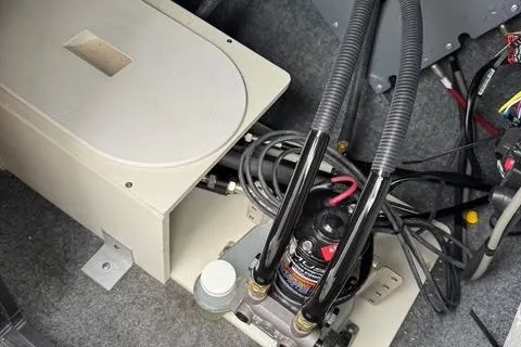 Slide: The Image of 2023 Yamaha Boats 222XD engine compartment with hydraulic components and wiring. - 7