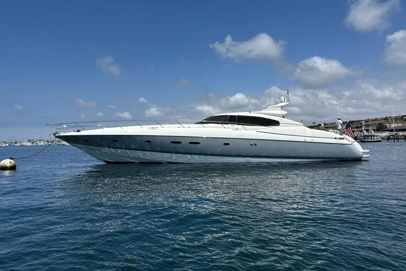 The Image of 1998 Sunseeker Predator 80 yacht on calm water under a clear blue sky. - 0
