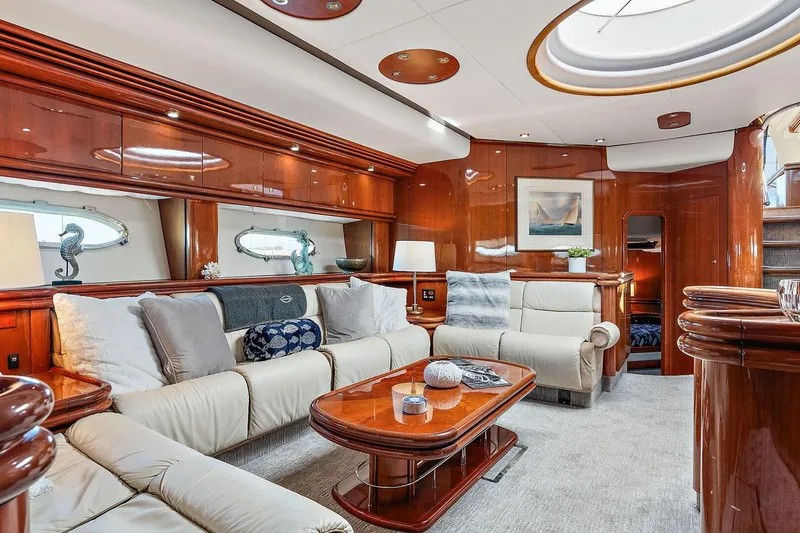 Slide: The Image of Luxurious interior of 1998 Sunseeker Predator 80 yacht with elegant wood finishes and plush seating. - 10