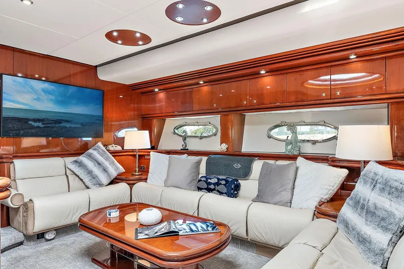 Slide: The Image of Luxurious Sunseeker Predator 80 yacht interior with plush seating and elegant wood finishes. - 11