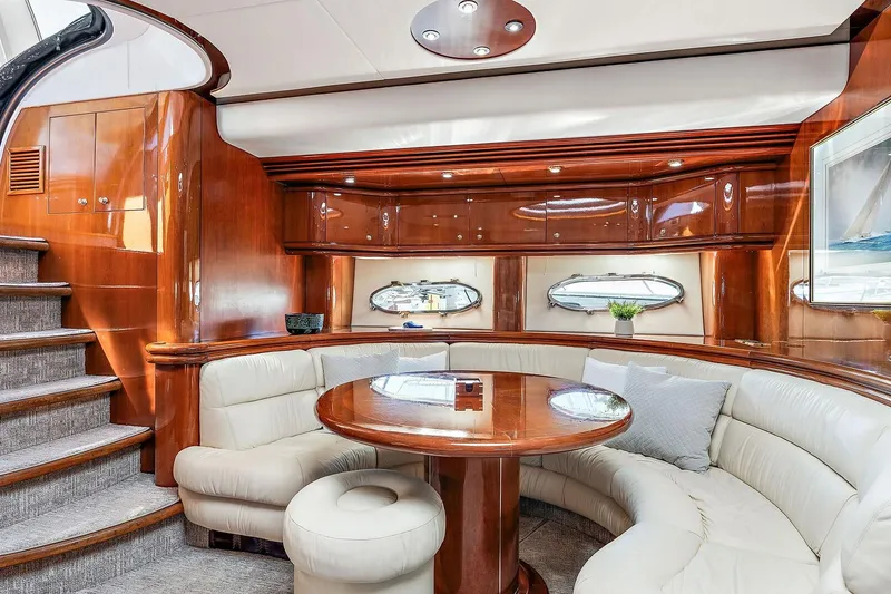 Slide: The Image of Luxurious interior of 1998 Sunseeker Predator 80 yacht with elegant wood finishes and plush seating. - 12