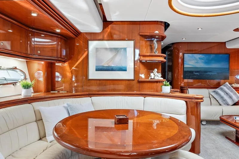 Slide: The Image of Luxurious interior of 1998 Sunseeker Predator 80 yacht with elegant wood finishes and plush seating. - 16