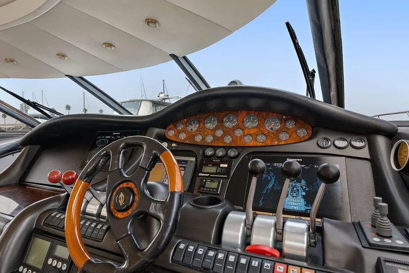 Slide: The Image of Cockpit of 1998 Sunseeker Predator 80 yacht with steering wheel and control panel. - 5