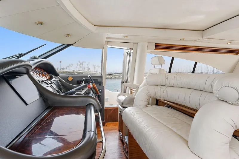 Slide: The Image of Luxurious interior of 1998 Sunseeker Predator 80 yacht with plush seating and sleek dashboard. - 6