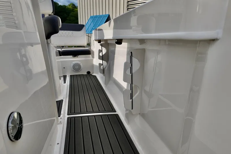 Slide: The Image of 2024 Bayliner TROPHY 22 CX boat interior with sleek flooring and seating. - 11
