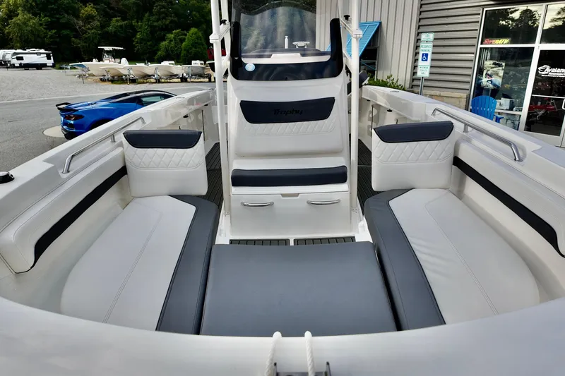 Slide: The Image of 2024 Bayliner TROPHY 22 CX boat interior with cushioned seating and modern design. - 5