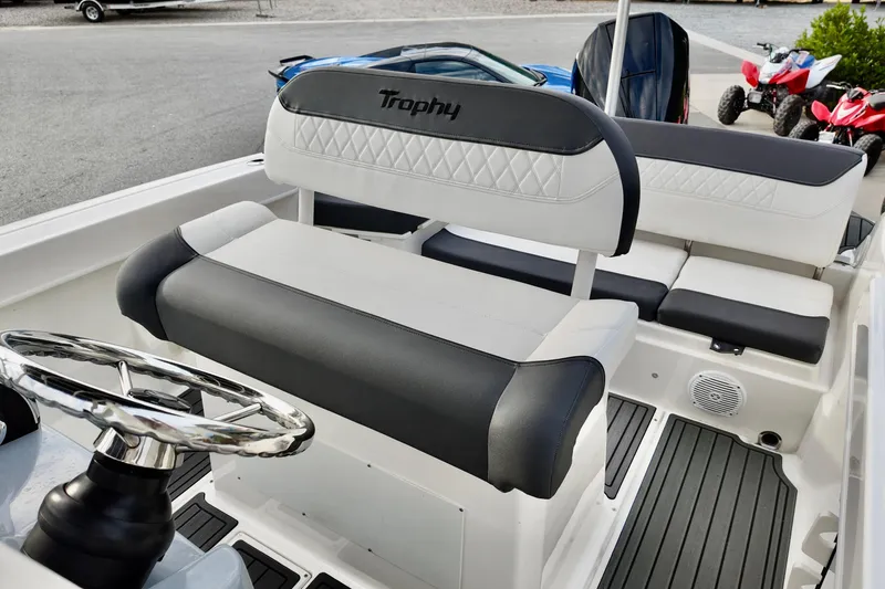 Slide: The Image of 2024 Bayliner TROPHY 22 CX boat interior with stylish seating and steering wheel. - 8