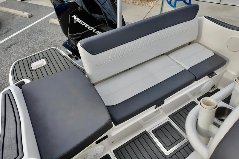 Slide: The Image of 2024 Bayliner TROPHY 22 CX boat seating area with sleek design and comfortable cushions. - 9