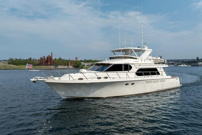Slide: The Image of 2005 Ocean Alexander 64 Motoryacht cruising on a scenic waterway. - 1