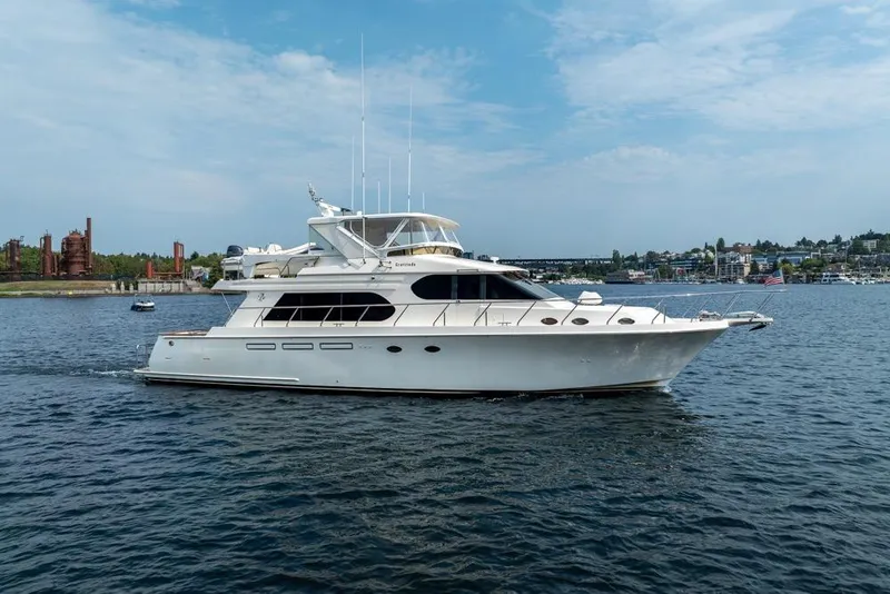 Slide: The Image of 2005 Ocean Alexander 64 Motoryacht cruising on a scenic waterway. - 10