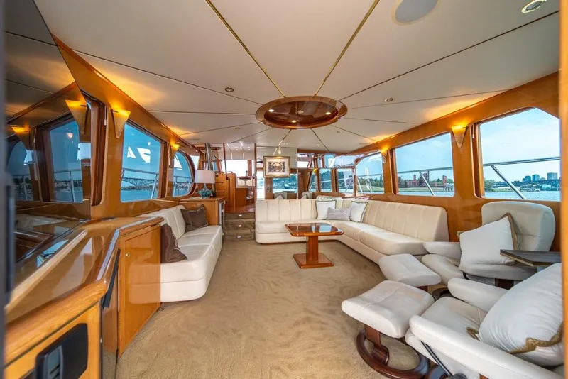 Slide: The Image of Luxurious interior of 2005 Ocean Alexander 64 Motoryacht with elegant seating and panoramic windows. - 13
