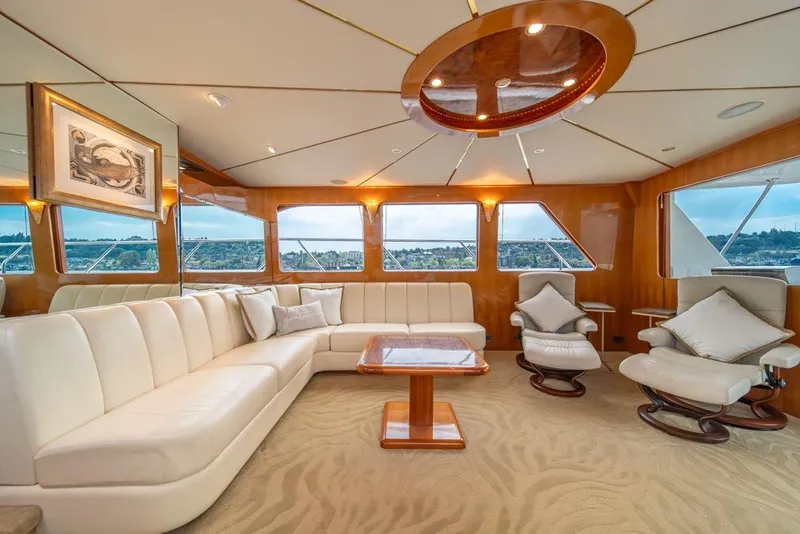 Slide: The Image of Luxurious interior of 2005 Ocean Alexander 64 Motoryacht with elegant seating and panoramic windows. - 16