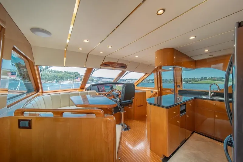 Slide: The Image of Luxurious interior of 2005 Ocean Alexander 64 Motoryacht with panoramic windows and modern kitchen. - 17