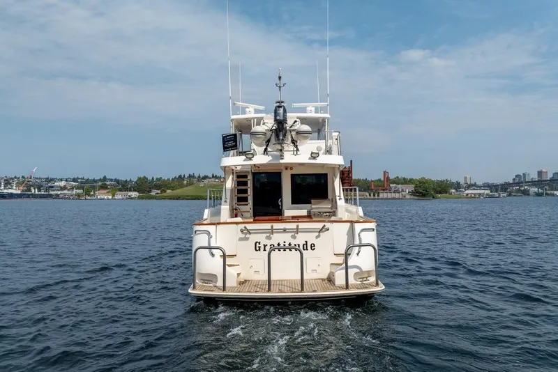Slide: The Image of 2005 Ocean Alexander 64 Motoryacht on open water, rear view. - 2