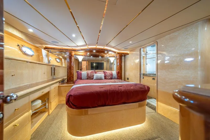 Slide: The Image of Luxurious bedroom interior of 2005 Ocean Alexander 64 Motoryacht with elegant wood finishes. - 25