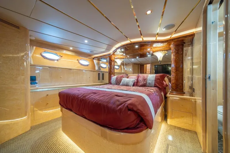 Slide: The Image of Luxurious bedroom interior of 2005 Ocean Alexander 64 Motoryacht with elegant wood finishes. - 26