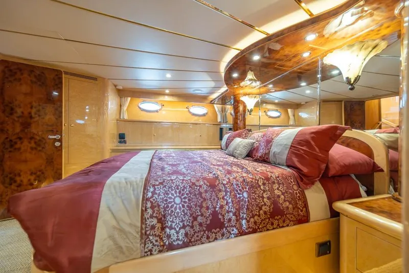 Slide: The Image of Luxurious bedroom in 2005 Ocean Alexander 64 Motoryacht with elegant decor and ambient lighting. - 27