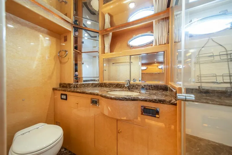 Slide: The Image of Luxurious bathroom in 2005 Ocean Alexander 64 Motoryacht with marble countertop and modern fixtures. - 29
