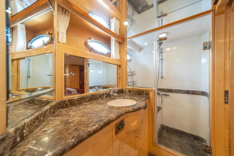 Slide: The Image of Luxurious bathroom in 2005 Ocean Alexander 64 Motoryacht with marble countertop and shower. - 30