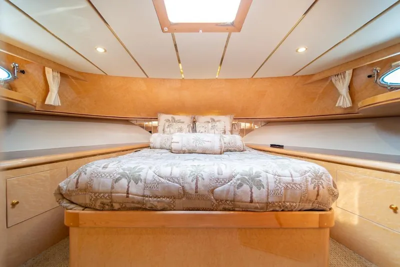 Slide: The Image of Luxurious bedroom interior of 2005 Ocean Alexander 64 Motoryacht with elegant bedding and wood finishes. - 31