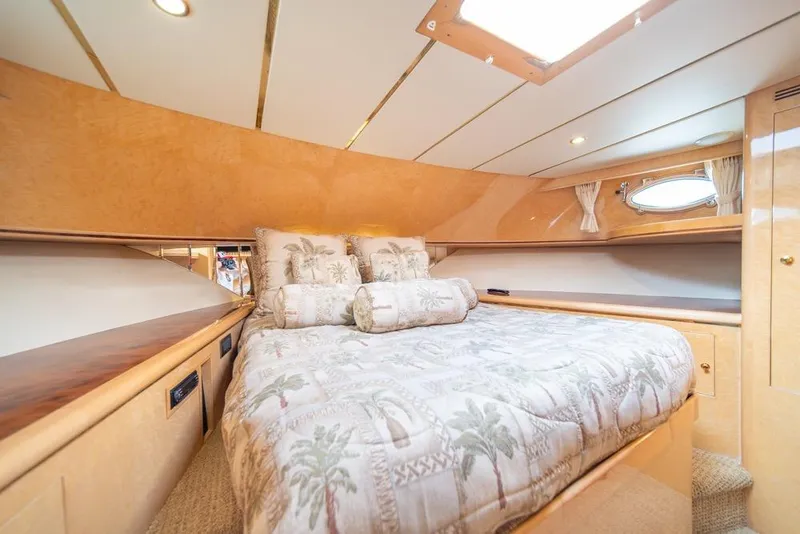 Slide: The Image of Luxurious bedroom interior of 2005 Ocean Alexander 64 Motoryacht with elegant bedding and wood finishes. - 32
