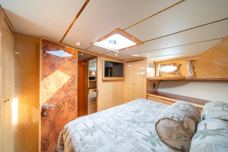 Slide: The Image of Luxurious bedroom interior of 2005 Ocean Alexander 64 Motoryacht with elegant wood finishes. - 33