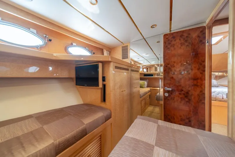 Slide: The Image of Luxurious interior of 2005 Ocean Alexander 64 Motoryacht with cozy cabin and elegant wood finishes. - 38