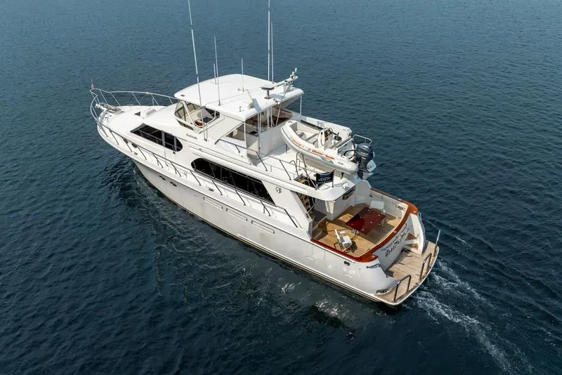 Slide: The Image of 2005 Ocean Alexander 64 Motoryacht cruising on open water, aerial view. - 4
