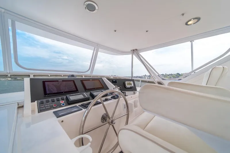 Slide: The Image of Helm of 2005 Ocean Alexander 64 Motoryacht with modern navigation equipment and panoramic views. - 41