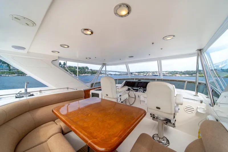 Slide: The Image of Luxurious 2005 Ocean Alexander 64 Motoryacht helm with panoramic views and elegant seating. - 43
