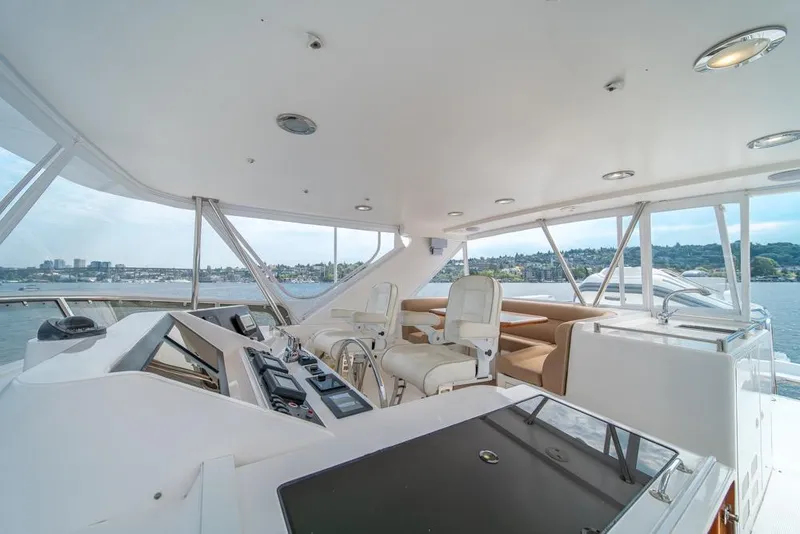 Slide: The Image of 2005 Ocean Alexander 64 Motoryacht helm with panoramic water views. - 44