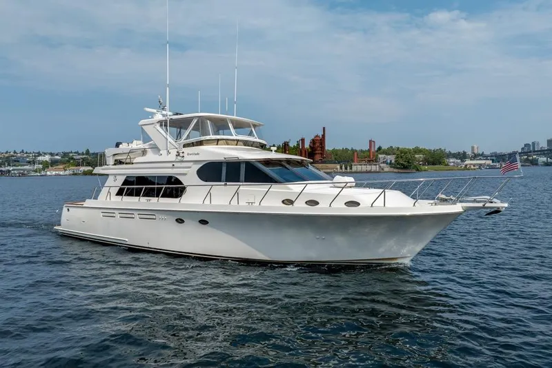 Slide: The Image of 2005 Ocean Alexander 64 Motoryacht cruising on a calm waterway. - 5
