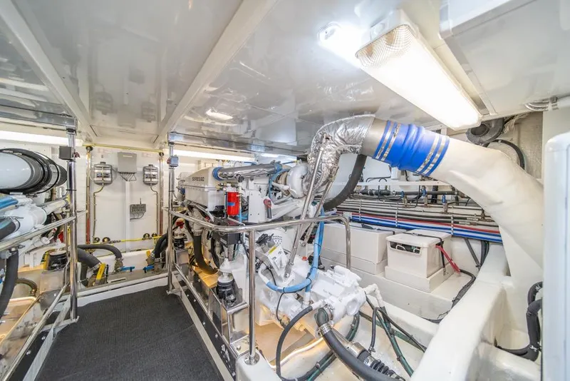 Slide: The Image of Engine room of 2005 Ocean Alexander 64 Motoryacht, showcasing mechanical systems and equipment. - 57