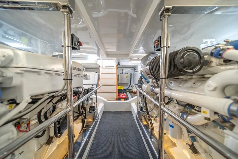 Slide: The Image of Engine room of 2005 Ocean Alexander 64 Motoryacht, showcasing machinery and equipment. - 58