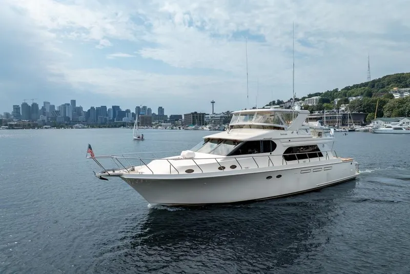 Slide: The Image of 2005 Ocean Alexander 64 Motoryacht cruising near city skyline and waterfront. - 7