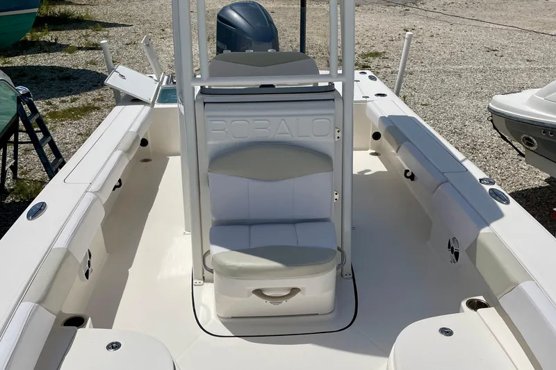 Slide: The Image of 2015 Robalo 246 Cayman boat interior with seating and storage compartments. - 22